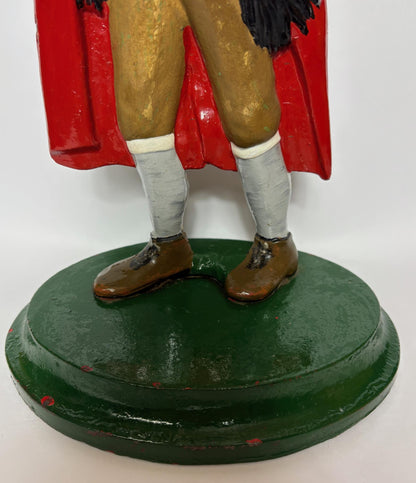 Early 20th‑century cast‑iron doorstop of Bob Cratchit & Tiny Tim from Dickens’ A Christmas Carol.