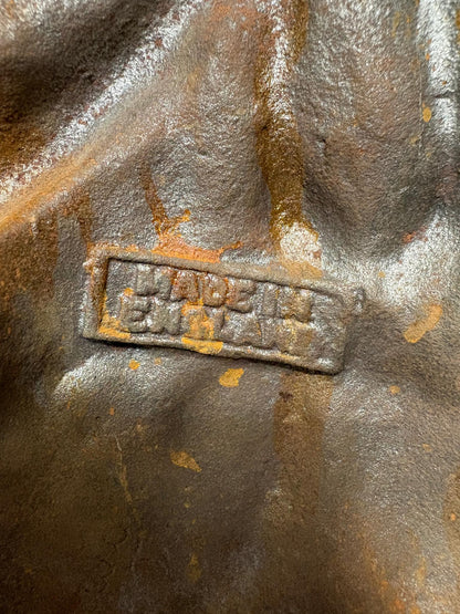 Early 20th‑century cast‑iron doorstop of Bob Cratchit & Tiny Tim from Dickens’ A Christmas Carol.