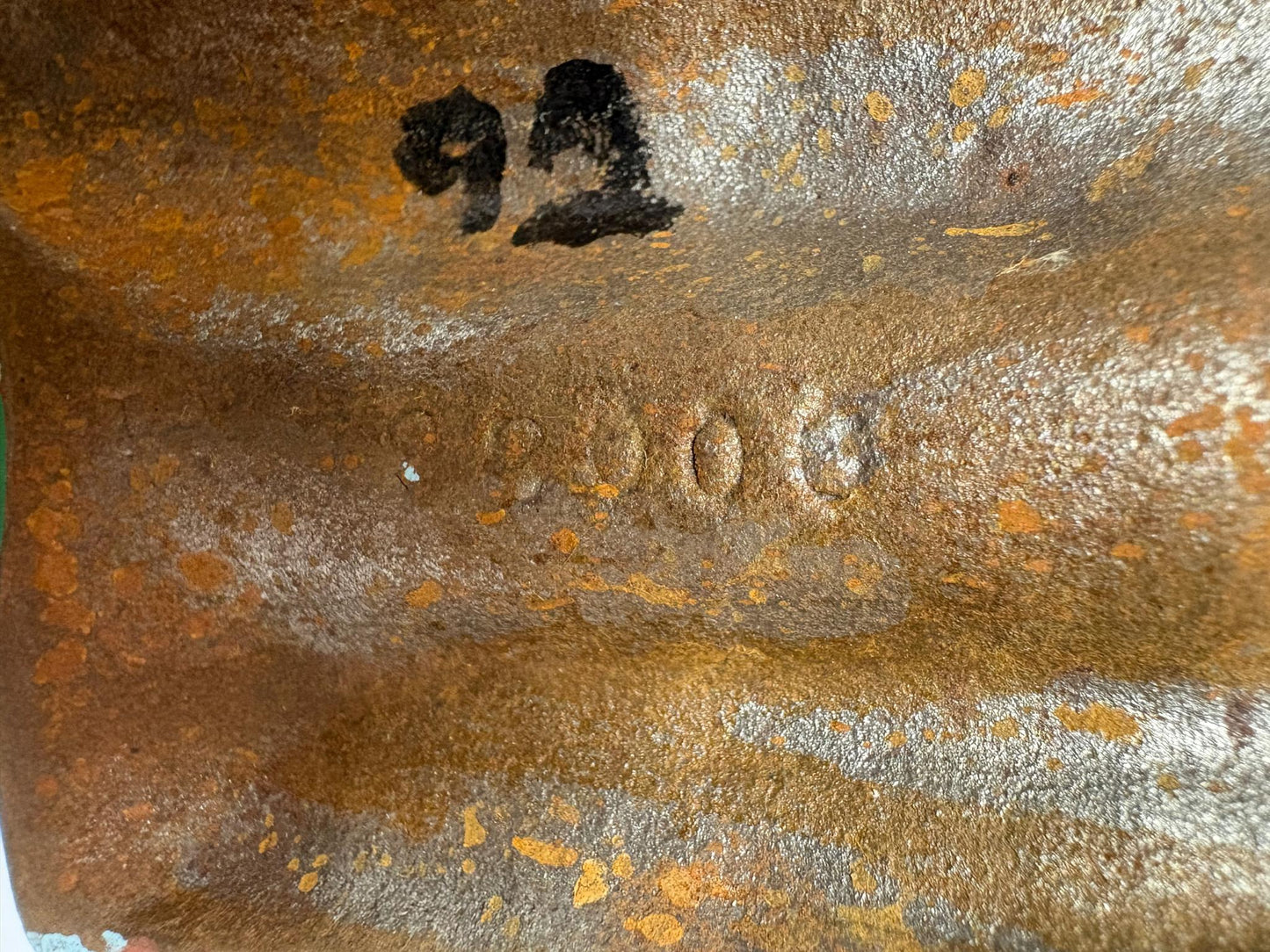 Early 20th‑century cast‑iron doorstop of Bob Cratchit & Tiny Tim from Dickens’ A Christmas Carol.