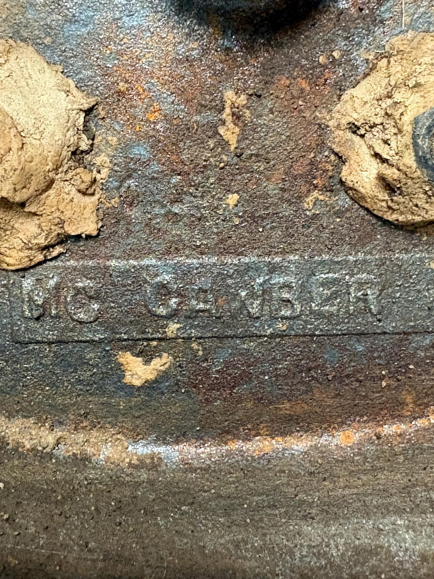 Early 20th‑century cast‑iron doorstop of Bob Cratchit & Tiny Tim from Dickens’ A Christmas Carol.